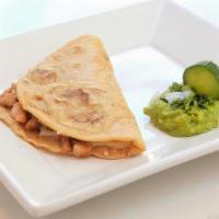 Pollo Quesadilla · grilled chicken. Handmade to order on 100% gluten free corn tortillas and served with guacam...