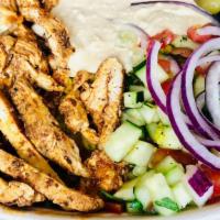 Chicken Shawarma Plate · Thinly sliced, marinated and rotisserie roasted chicken shawarma, served on a bed of our aro...
