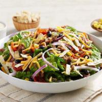 Beyond Taco Salad-Small · Plant-Based Beyond Beef® served over crisp romaine with cheddar cheese, red onions, and blac...
