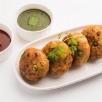Alu Tikki · Fried spiced potato fritters coated with bread crumbs and served with tangy & spicy chutney.