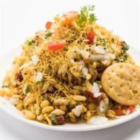 Dahi Puri · Crisp wheat and lentil puffed nuggets with veggie filling and yogurt.