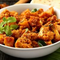 Aloo Gobi · Potatoes and cauliflower cooked with ginger and tomatoes.
