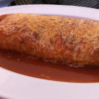 Carne Asada Wet Burrito · Served with sour cream, guacamole, pasilla sauce and covered with melted cheese.