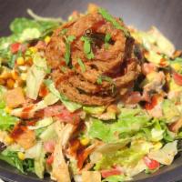 Bbq Chicken Chop Salad Full · A saddle ranch chop house signature dish. Crisp romaine lettuce, roasted BBQ chicken, avocad...