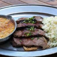 Slow-Roasted Tri-Tip- Half · Perfectly seasoned, slow-roasted tri-tip, thinly sliced and topped with saddle ranch’s own s...