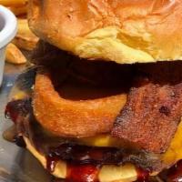 Bbq Burger · Smothered in BBQ sauce and topped with three-pepper bacon, cheddar cheese and onion rings, o...
