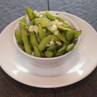 Garlic Edamame · Boiled green soybeans sautéed with olive oil and garlic.