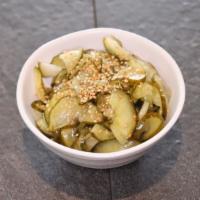 Cucumber Salad · A cucumber side dish marinated in vinegar, sugar, and salt topped with a dash of sesame seed...