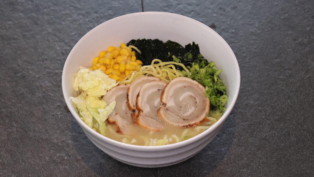 Miso Ramen · Egg noodles in miso & tonkotsu broth (pork marrow) served with our house-made chashu (braised pork belly), corn, napa cabbage, green onion, and wakame (seaweed).
