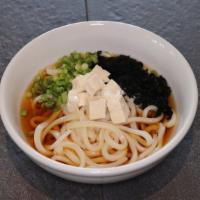 Udon Noodle Soup · Thick, wheat-flour noodle served with tofu, green onion, and wakame (seaweed) in udon broth.