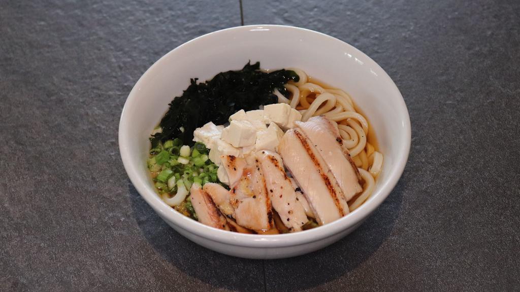 Chicken Teriyaki Udon Soup · Thick, wheat-flour noodle served with teriyaki chicken, tofu, green onion, and wakame (seaweed) in udon broth.