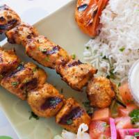 Chicken Kebab Plate  · 1 chicken skewer With garlic sauce. Served with hummus, salad, rice, grilled vegetables  and...