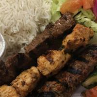 King'S Combo Plate · Beef, chicken, and 
Lamb skewers. Served with hummus, salad, rice, sauce and 2 pitas.