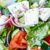 Greek Salad · lettuce ,cucumber,fresh tomato  green olive and fetta cheese , onion