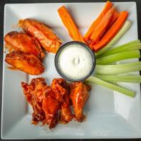 Large Rock Wings · Buffalo, sweet & spicy BBQ, garlic Parmesan served with carrots & choice of ranch, blue chee...