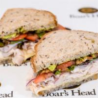 California Club · Roasted turkey, avocado, sprouts, applewood smoked bacon, tomato, Swiss cheese and herb mari...
