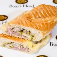 Cubano Panini · Pulled pork, ham, Swiss, whole grain mustard and house made pickles.