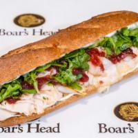 Turkey & Brie · Roasted turkey, brie cheese, baby arugula and cranberry chutney.