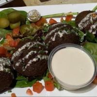 Falafel Platter · Platter – 5 pieces of falafel served with sesame sauce, hummus, pita bread and your choice o...