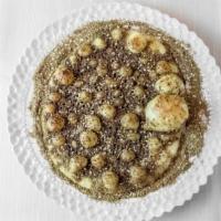 Zaatar · 8 inches round wheat bread dough, topped with thyme, sesame seeds, virgin olive oil, baked o...