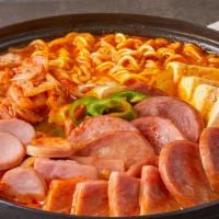Korean Military Stew (Medium Size) · Spicy beef broth with kimchi, spam, sausage, rice cake, ramen noodles, sliced pork, and gree...