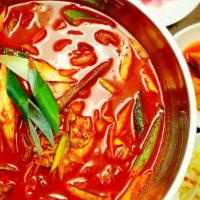 Yuk Gae Jang (육개장) · Hot and spicy broth with shredded beef, vegetables, and glass noodles.