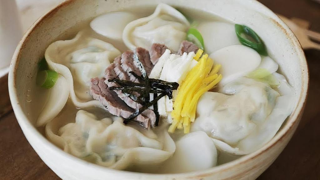 Rice Cake & Dumpling Soup (떡만두국) · Dumplings and rice cakes in beef broth. Dumplings are made with beef, pork, and vegetables.