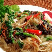 Jap Chae (잡채) · Pan fried yam noodles with vegetables and beef.