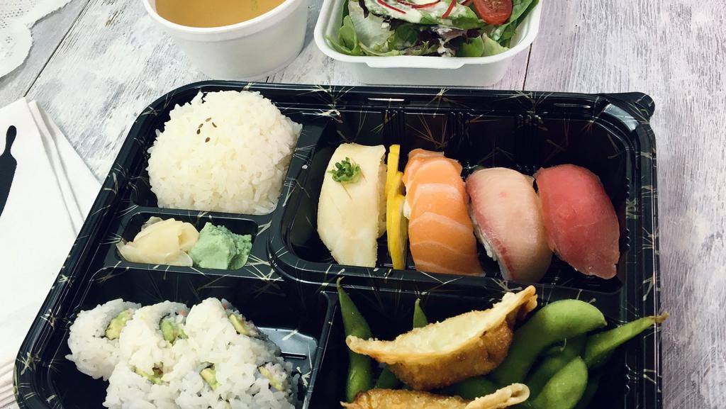 Sushi Bento · Bento boxes served with miso soup, salad, and rice and California roll.