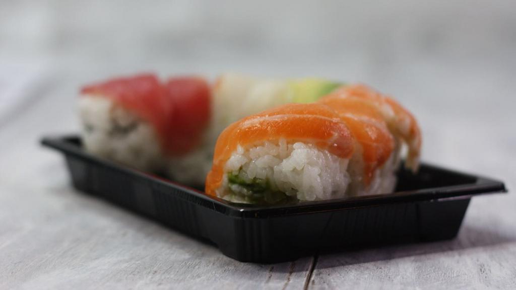Rainbow Roll · Inside stuffed with crab, avocado, cucumber. Outside salmon, tuna, snapper, and shrimp.