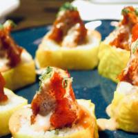 Yellow Submarine Roll · Inside stuffed with shrimp tempura, crab, and avocado. Outside soy wrapped, spicy tuna, and ...
