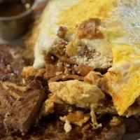Chilaquiles With A 13 Oz T Bone Steak · 