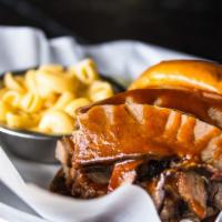 Mesquite Beef Brisket · A big helpin of Mesquite smoked Beef Brisket topped with TBG BBQ Sauce on a brioche bun and ...