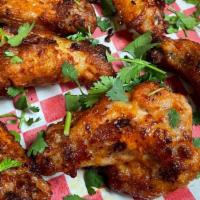 Chicken Wings · Oven roasted, Sweet BBQ, Hot, Tandoori, Sweet chili, Garlic Parmesan, Mango habanero