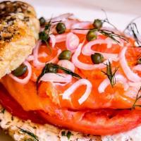 Lox Bagel · open face bagel of your choice, fresh smoked lox, cream cheese, tomato, onions, & capers