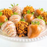 Cookie Butter · One Dozen Strawberries
(4) dipped in cookie butter spread.
(4) dipped in white chocolate wit...