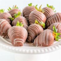 Original · One Dozen Strawberries
(12) dipped in milk chocolate with white chocolate drizzle.
Allergy W...
