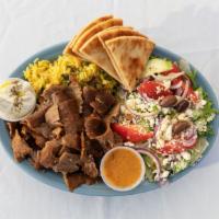 Gyro Plate · Grilled pita bread with shaved gyro, crumbled feta, fresh tomatoes, red onions, lettuce, and...