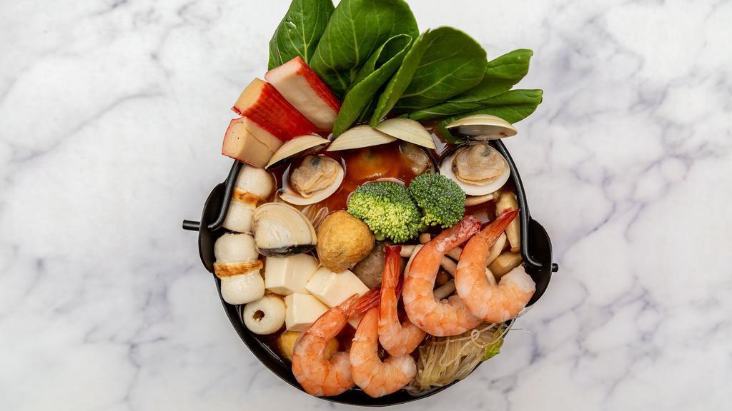 Seafood Pot · Shrimp, clam, squid ring, fish fillet, octopus, Chinese cabbage, mushroom, tofu, corn, tomato, meatball, udon noodles, fish tofu, and crab stick.