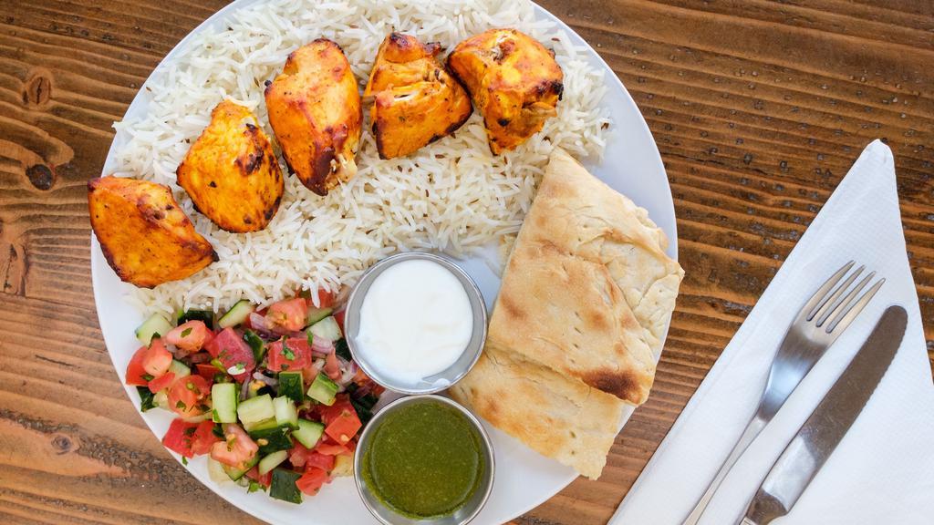 Tandoori Chicken Kabob · Five boneless skinless cubes of juicy chicken breast marinated in yogurt with a special seasoning and cooked in a tandoor oven.