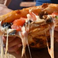 Vegetable Calzone · Mushrooms, Green Bell Peppers, Tomatoes, Black Olives, Red Onions, Mozzarella and Homemade M...