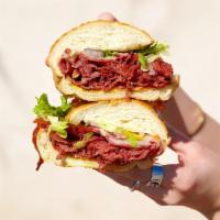 Large Corned Beef · Comes with Mustard, Mayo, Lettuce, Tomatoes, Pickles, Pepperoncinis and Onions