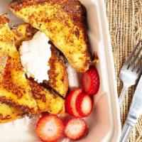 French Toast · on house-made brioche bread with fresh berries, whipped cream and maple syrup