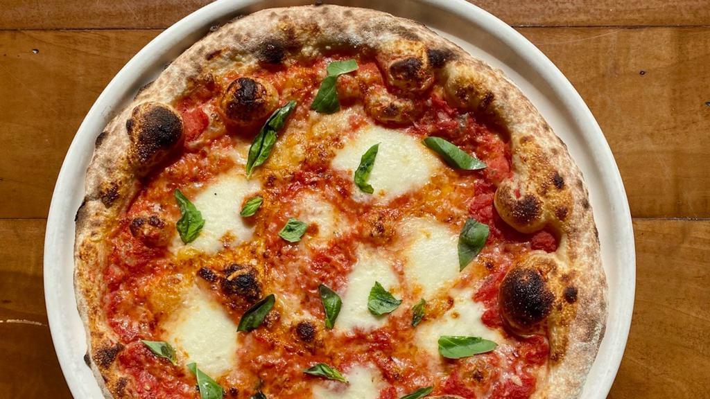 Margherita Pizza · tomato + house made mozzarella + basil