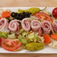 Antipasto Salad · Made with fresh iceberg lettuce, red cabbage, fresh tomato, black olives, ham, mortadella, s...
