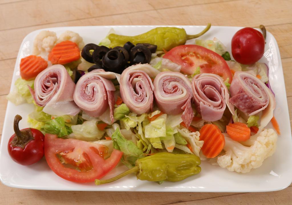 Antipasto Salad · Made with fresh iceberg lettuce, red cabbage, fresh tomato, black olives, ham, mortadella, salami, provolone cheese, pepperoncini and giardiniera.