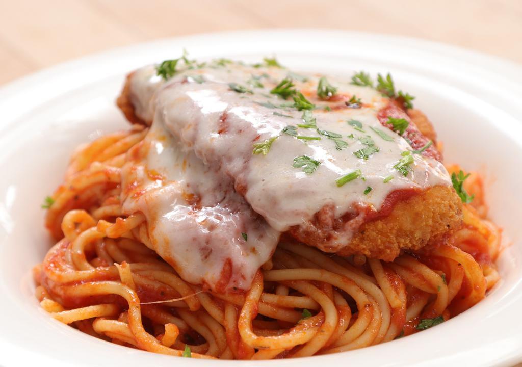 Chicken Parmigiana With Spaghetti · Spaghetti pasta served with chicken patties and homemade marinara sauce, topped with mozzarella and baked to perfection.