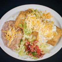Chimichanga Combination Plate · Beef or chicken. Served with rice and beans.