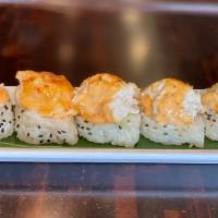 K-9 Roll · Baked spicy creamy blue crab on top of California roll in soy paper.