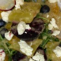 Beet Salad · Arugula, roasted red and golden beets, blueberries, watermelon radishes, and honey goat chee...